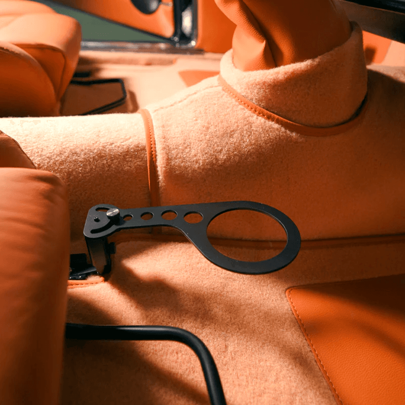 Rinashi cup holder with tumbler installed in a classic car interior
